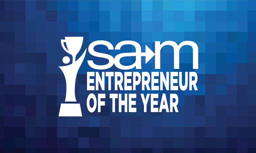 On a blue pixelated gradient background, a white stylized figure holds up a trophy beside the SAM logo with an integrated arrow, and below it the words “Entrepreneur of the Year” appear in bold white lettering.